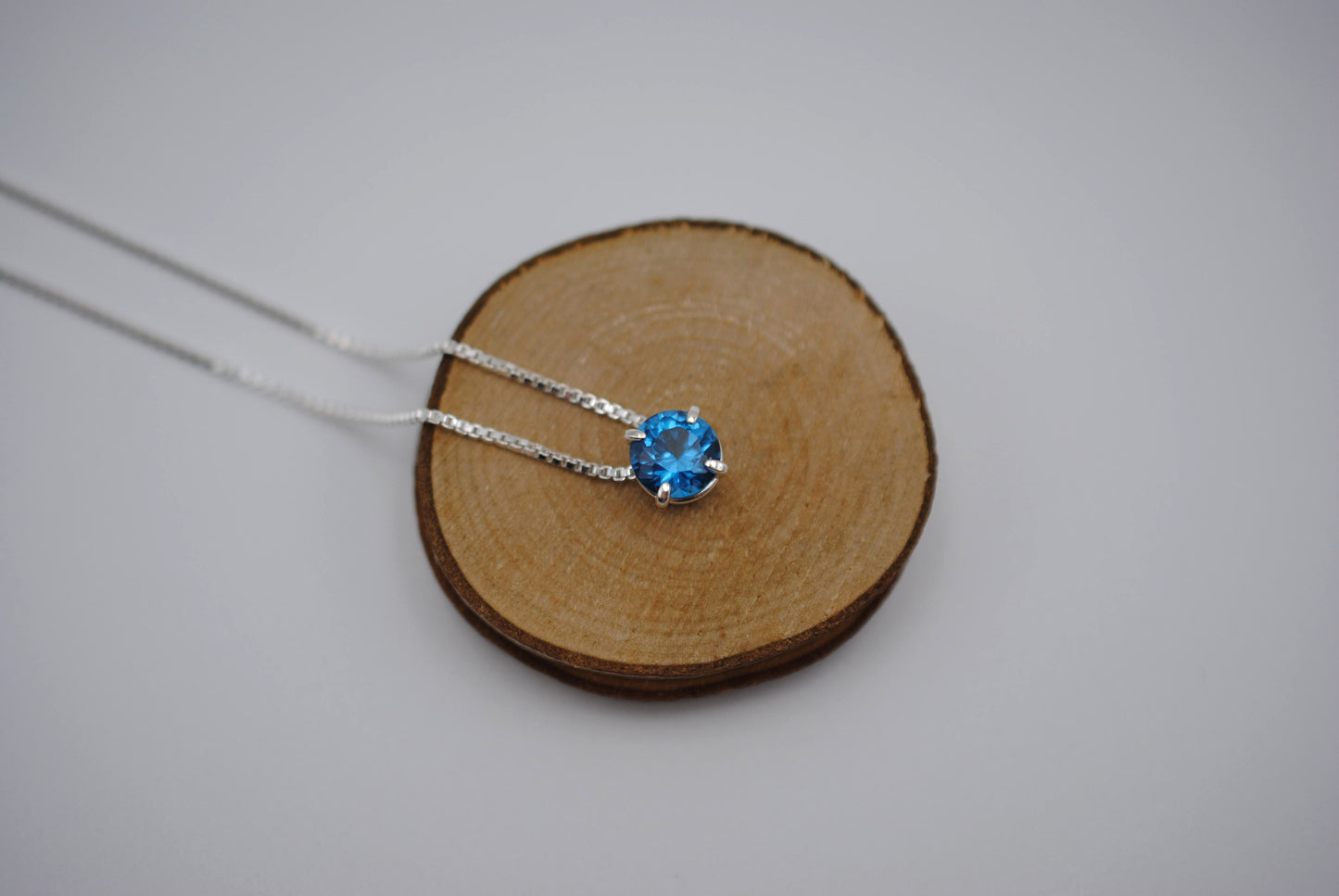 Birthstone Necklace: Round Blue Zircon, Silver Prong Setting, Adjustable Chain