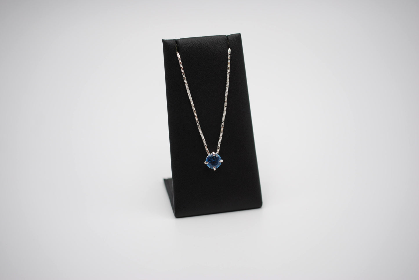 Birthstone Necklace: Round Blue Zircon, Silver Prong Setting, Adjustable Chain