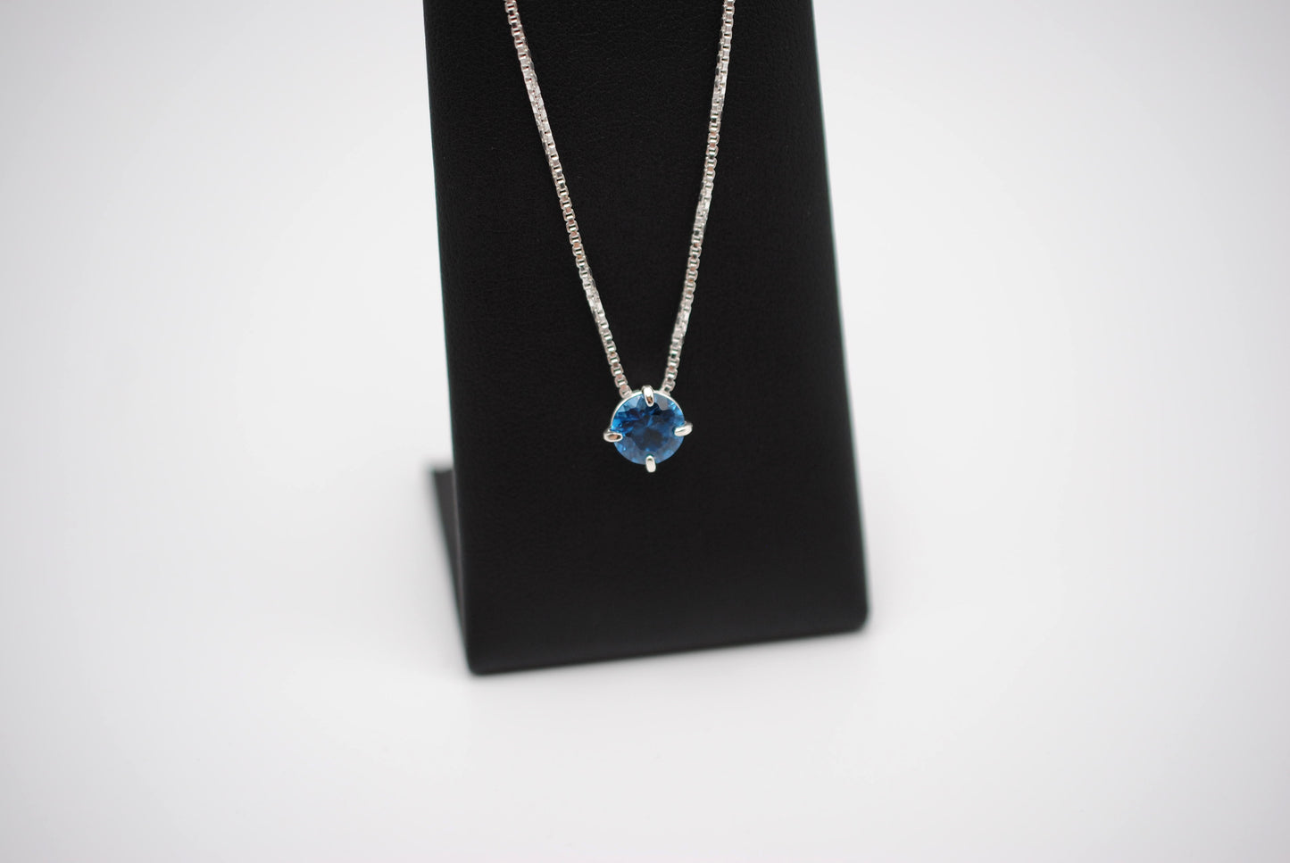 Birthstone Necklace: Round Blue Zircon, Silver Prong Setting, Adjustable Chain