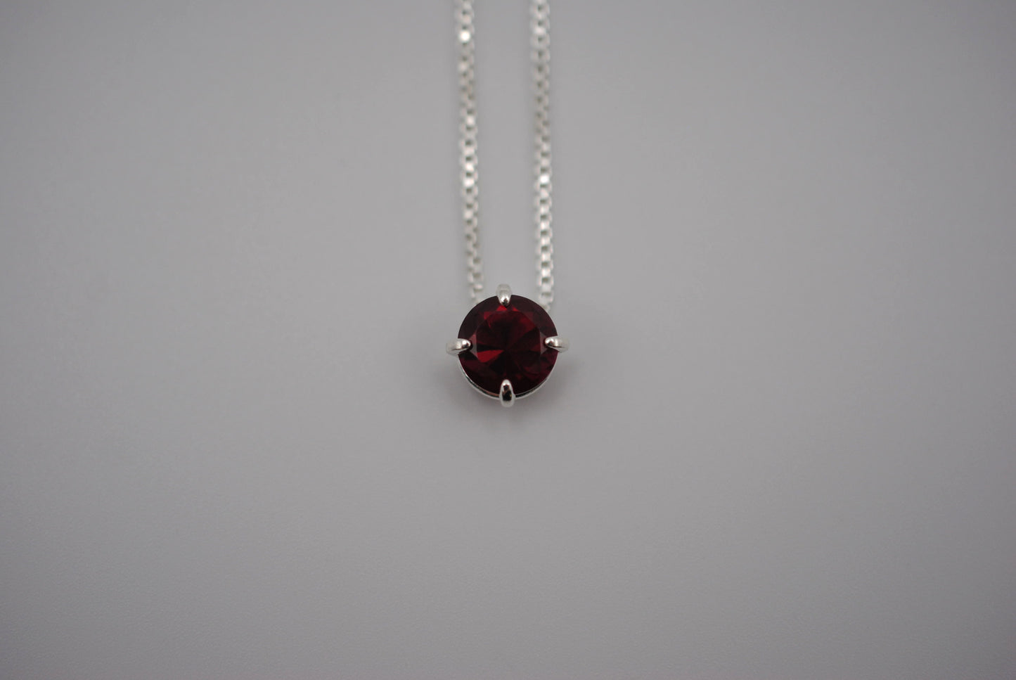 Birthstone Necklace: Round Garnet, Silver Prong Setting, Adjustable Chain
