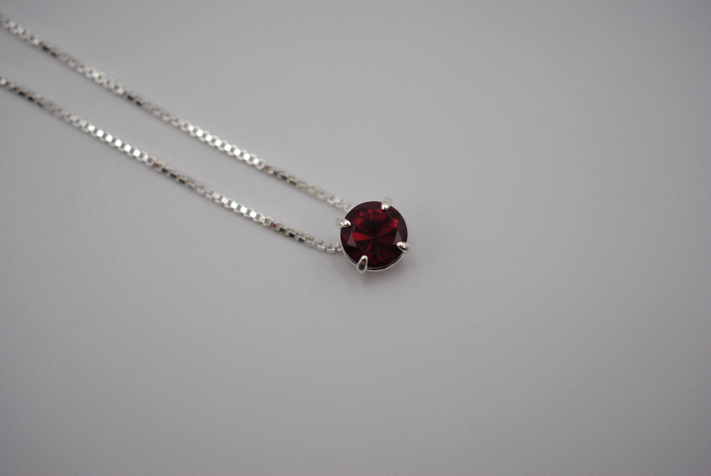 Birthstone Necklace: Round Garnet, Silver Prong Setting, Adjustable Chain