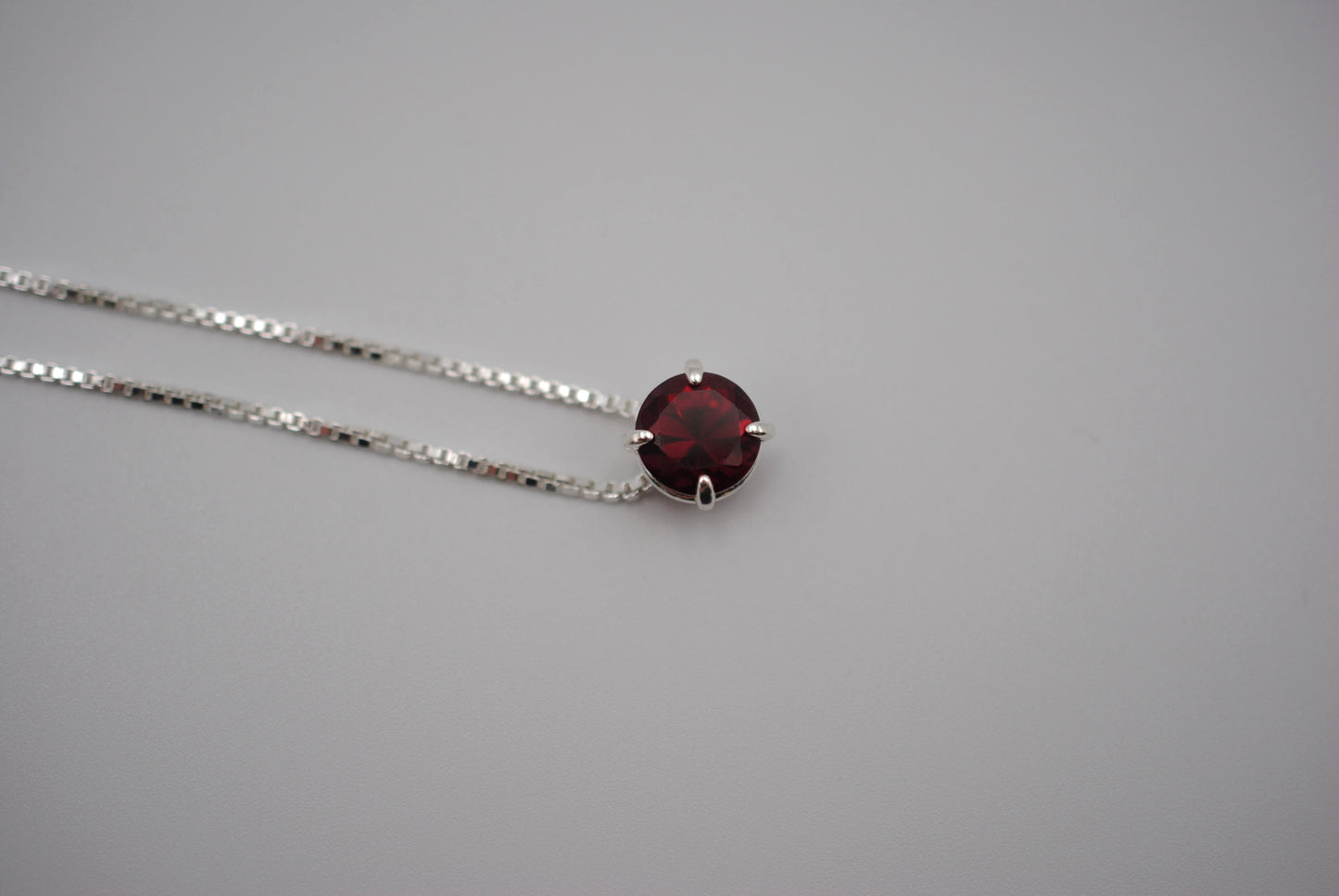 Birthstone Necklace: Round Garnet, Silver Prong Setting, Adjustable Chain
