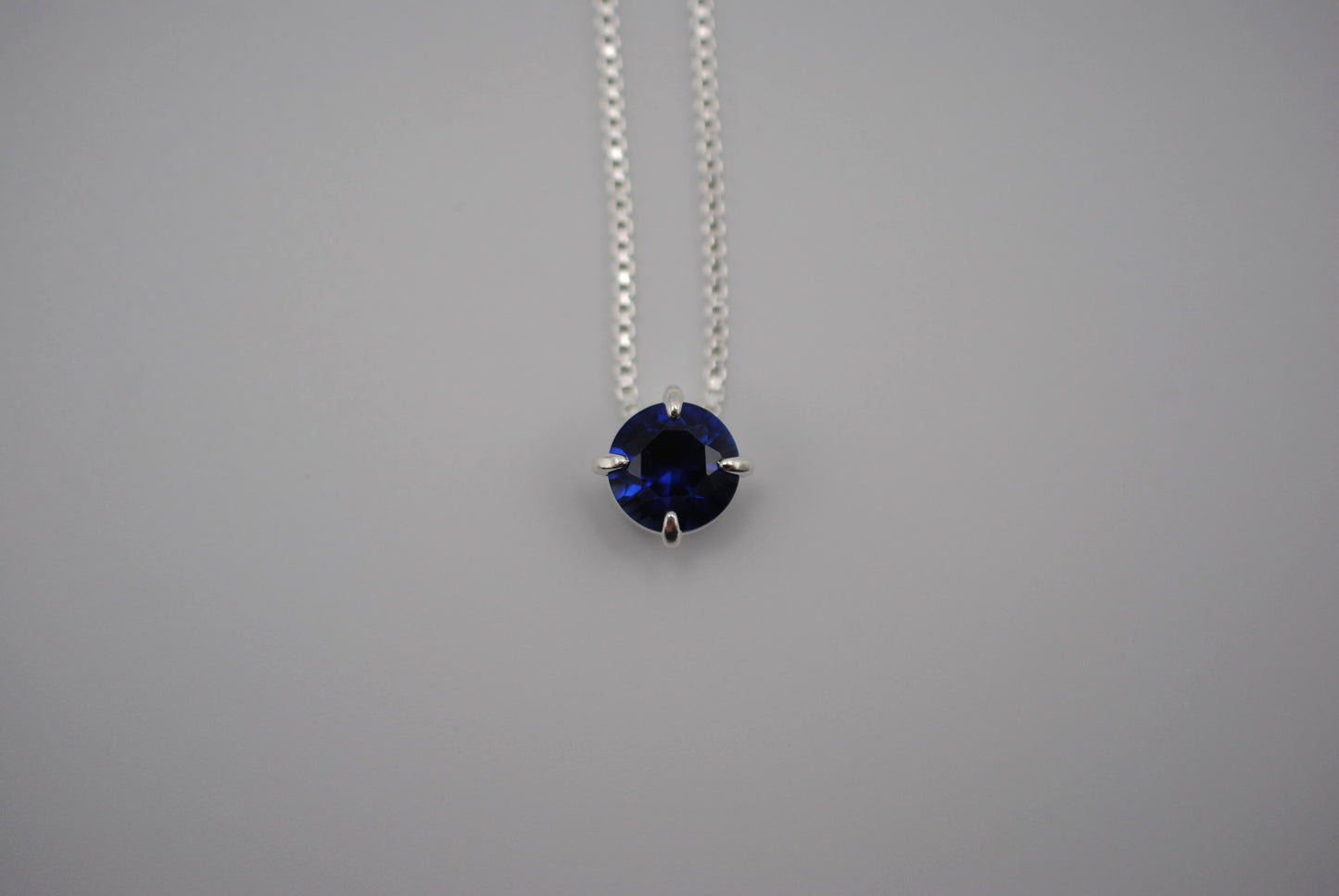 Birthstone Necklace: Round Sapphire, Silver Prong Setting, Adjustable Box Chain