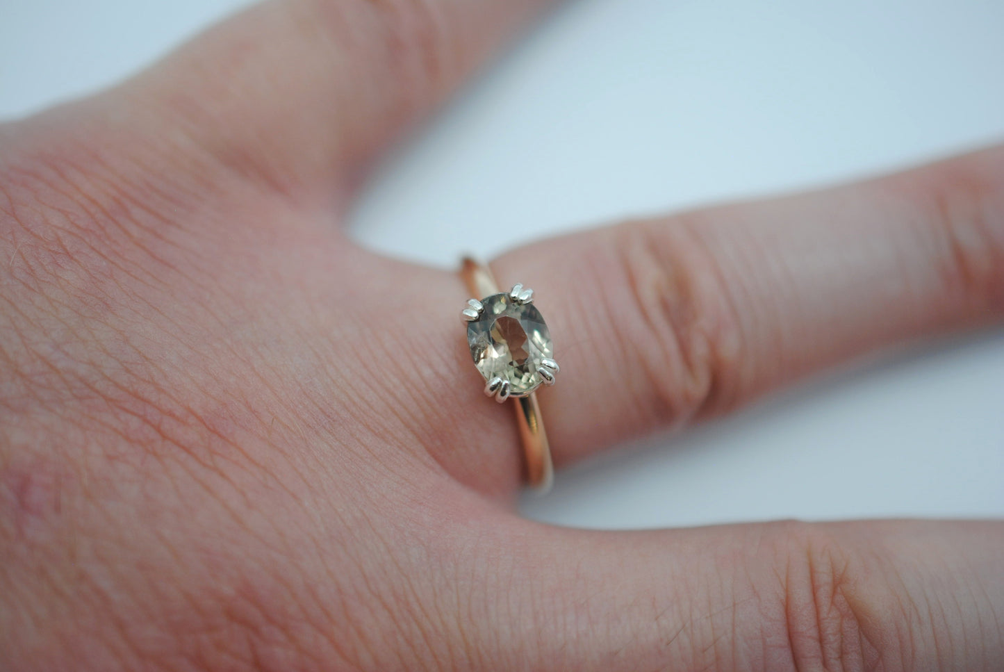 Diaspore Ring: Oval Cut, Yellow Gold Fill Band, East-West Silver Setting