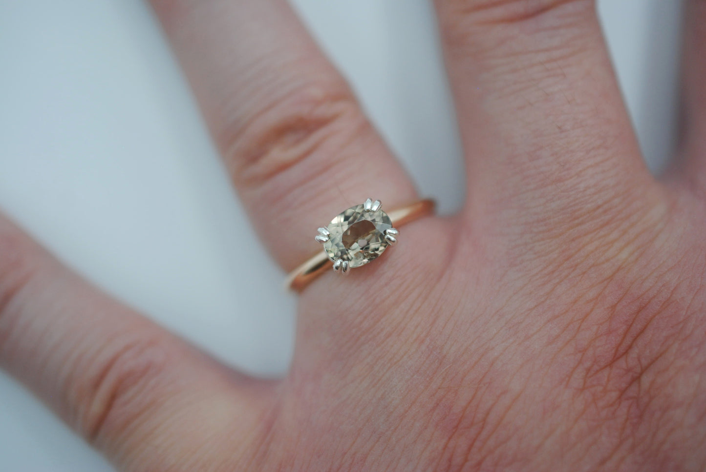 Diaspore Ring: Oval Cut, Yellow Gold Fill Band, East-West Silver Setting