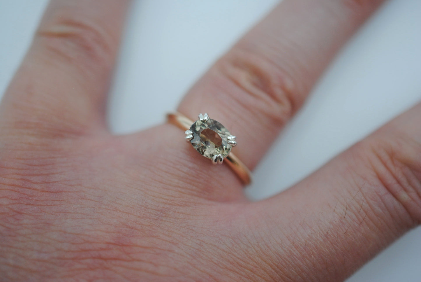 Diaspore Ring: Oval Cut, Yellow Gold Fill Band, East-West Silver Setting