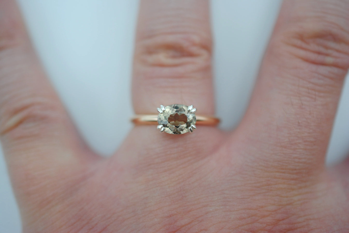 Diaspore Ring: Oval Cut, Yellow Gold Fill Band, East-West Silver Setting