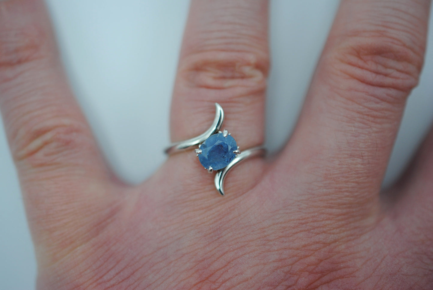 Sapphire Ring: Oval Cut, White Gold, Bypass Band