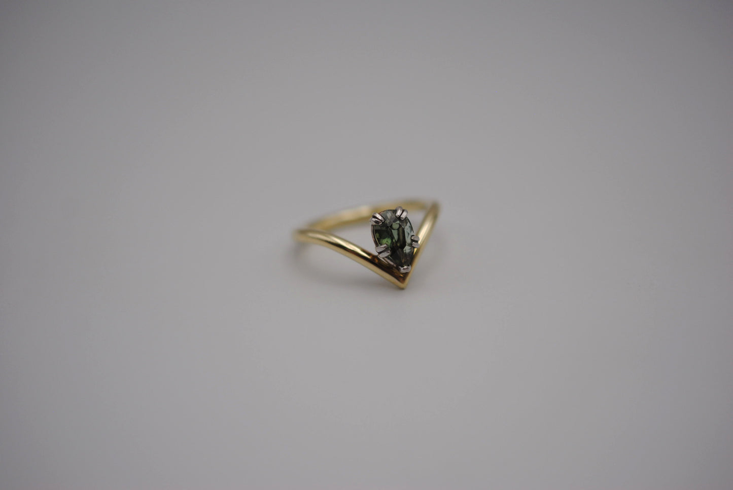 Sapphire Ring: Pear Cut, Green Gold Chevron Band, White Gold Setting