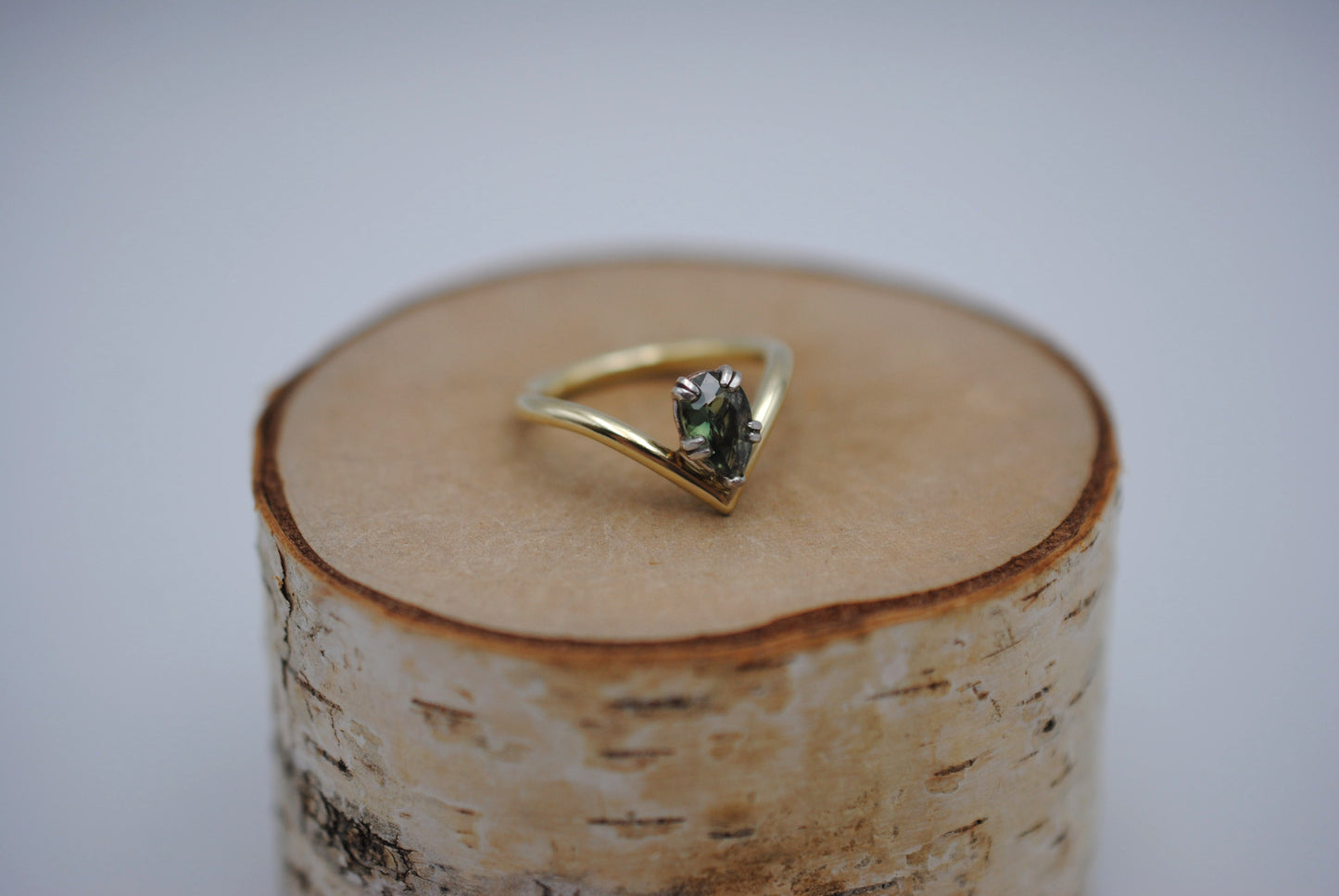 Sapphire Ring: Pear Cut, Green Gold Chevron Band, White Gold Setting