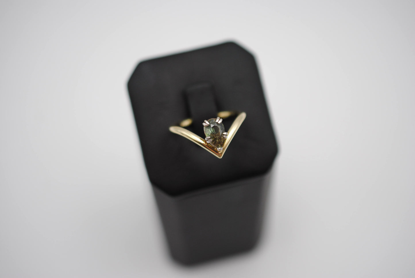 Sapphire Ring: Pear Cut, Green Gold Chevron Band, White Gold Setting