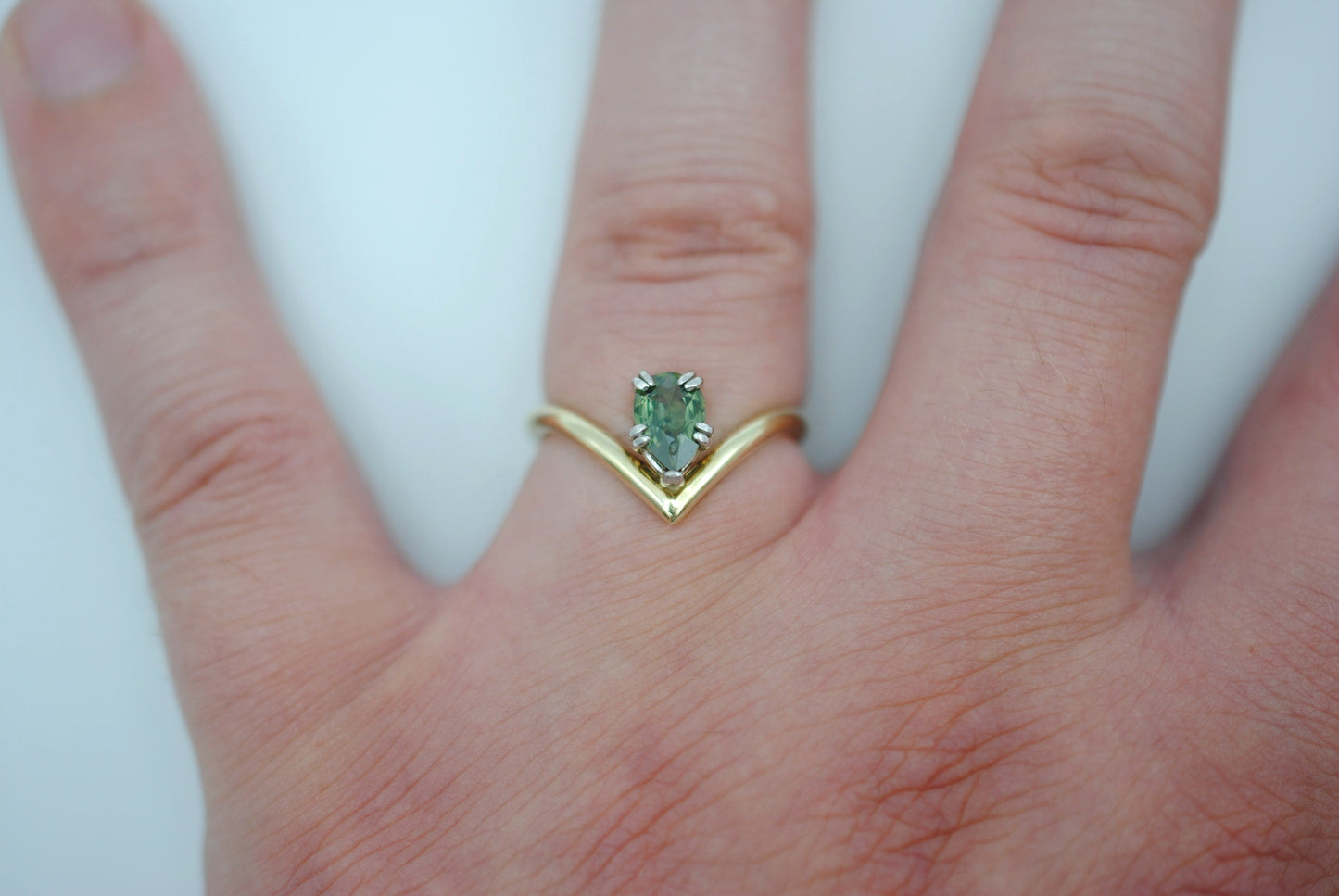 Sapphire Ring: Pear Cut, Green Gold Chevron Band, White Gold Setting