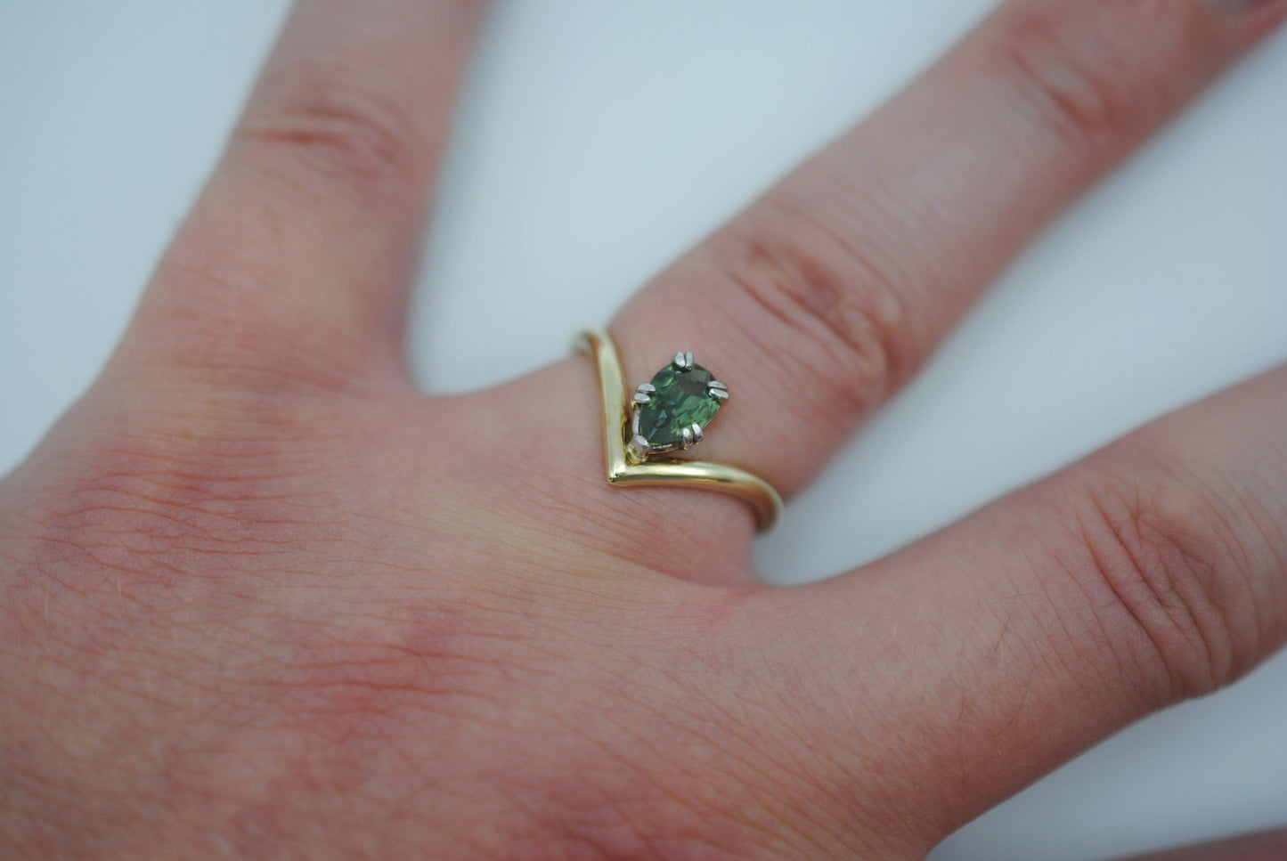 Sapphire Ring: Pear Cut, Green Gold Chevron Band, White Gold Setting