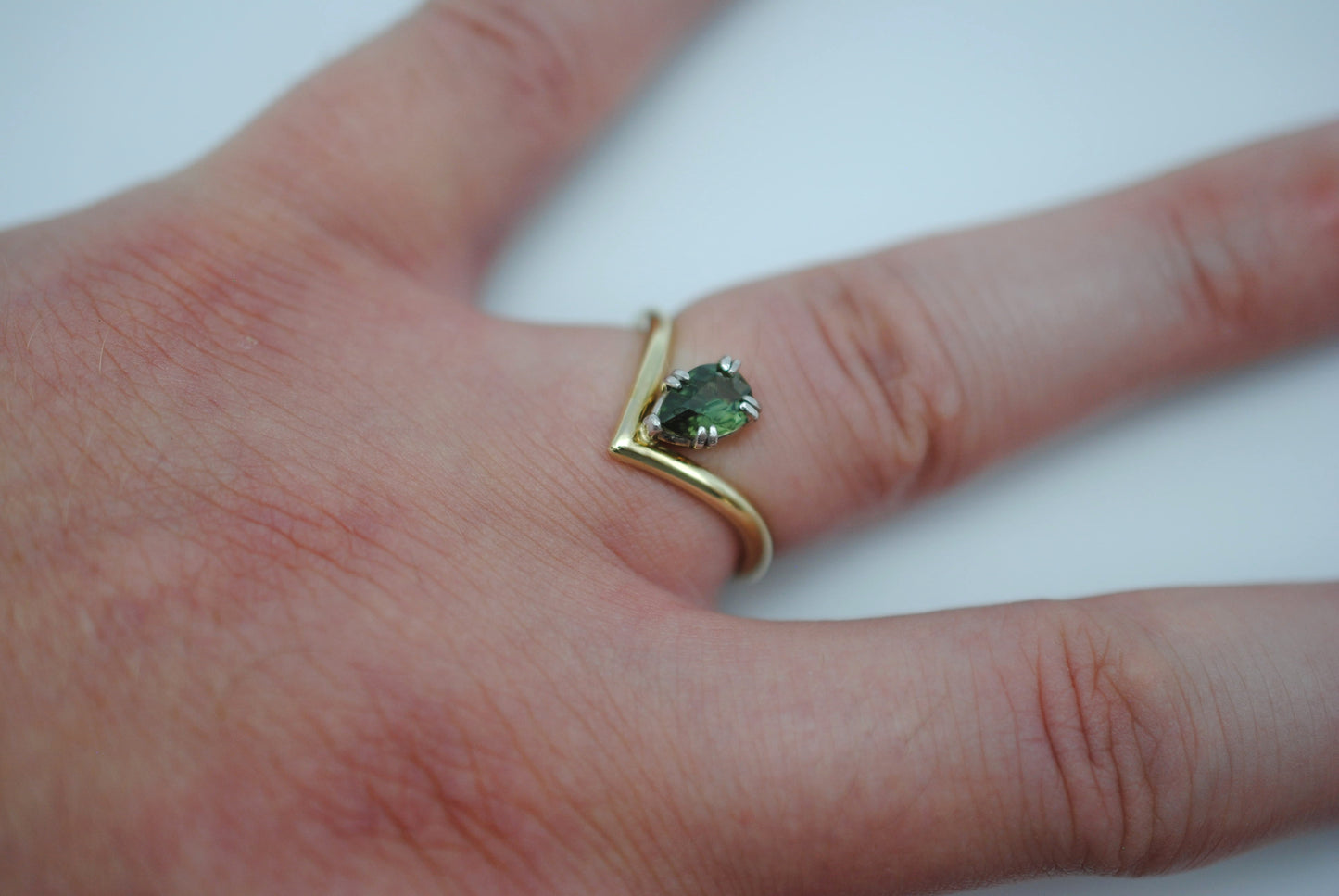 Sapphire Ring: Pear Cut, Green Gold Chevron Band, White Gold Setting
