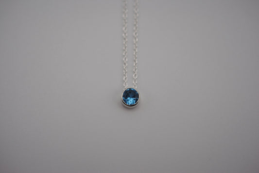 Birthstone Necklace: Round Blue Zircon, Bezel, Silver, Cable Chain