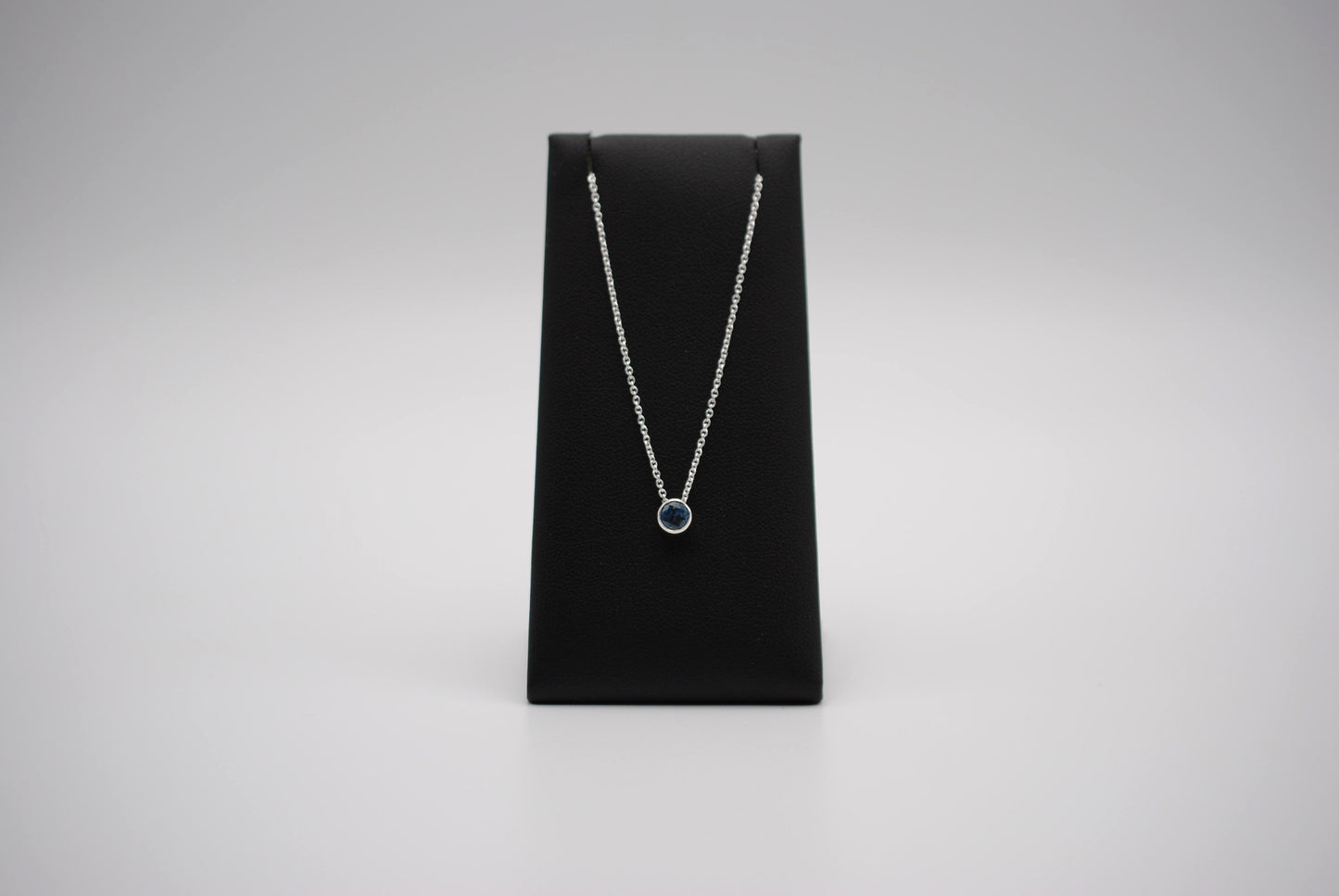 Birthstone Necklace: Round Blue Zircon, Bezel, Silver, Cable Chain