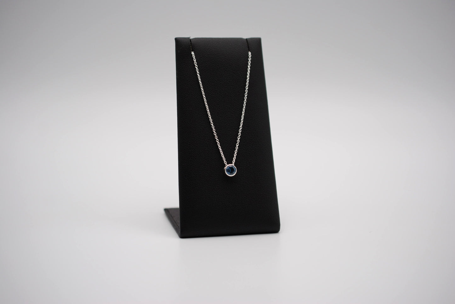 Birthstone Necklace: Round Blue Zircon, Bezel, Silver, Cable Chain