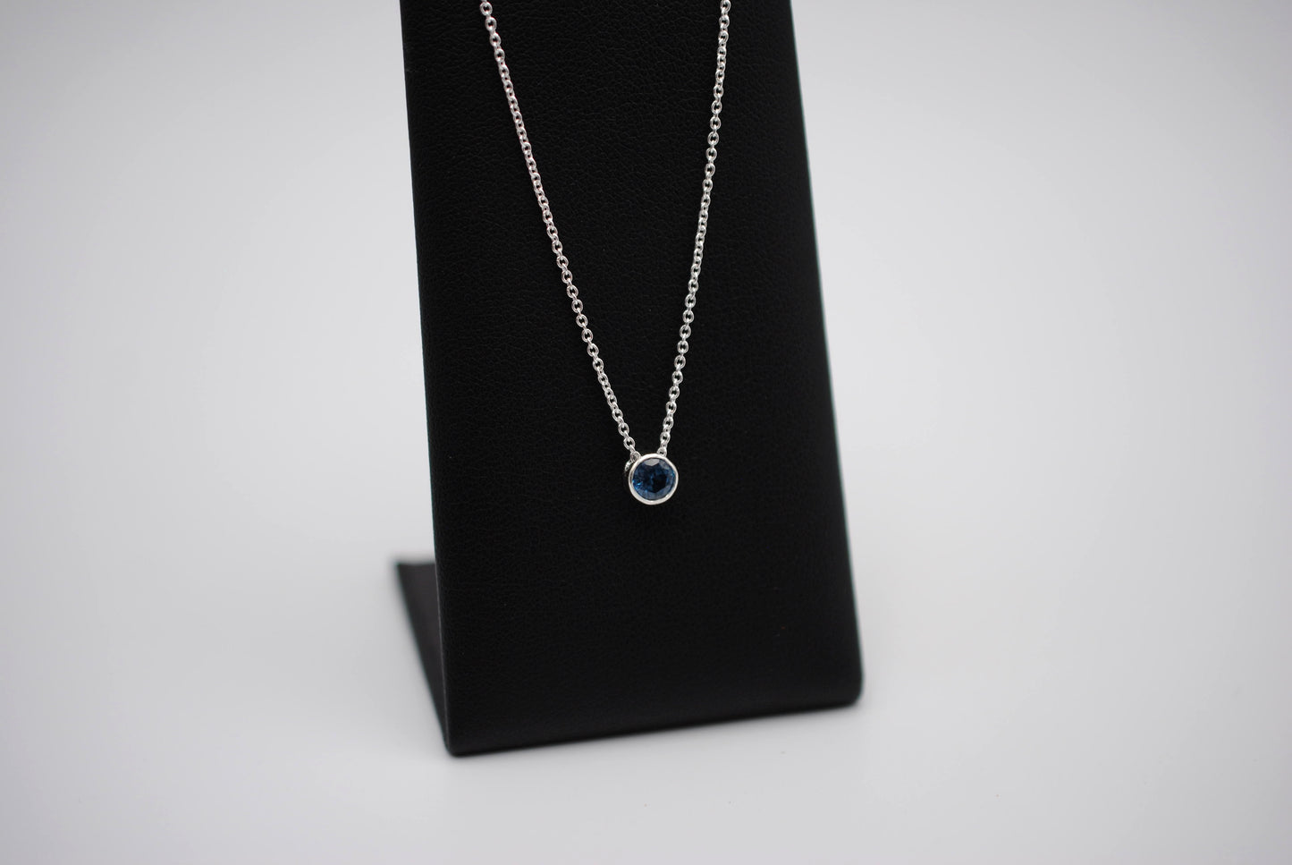 Birthstone Necklace: Round Blue Zircon, Bezel, Silver, Cable Chain