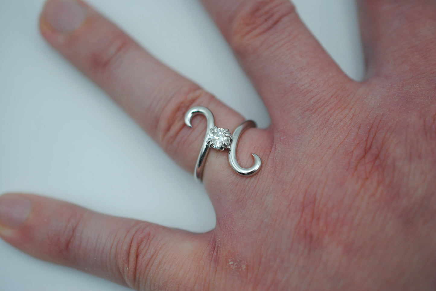 Moissanite Ring: Round Cut, Bypass, Rhodium Finish