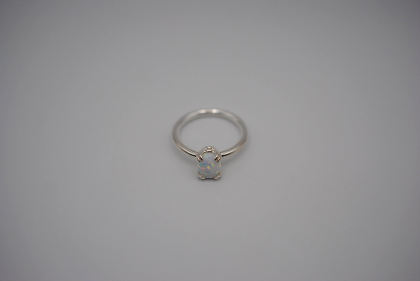 Opal Ring: Oval Cut, Silver, Double Prong Setting