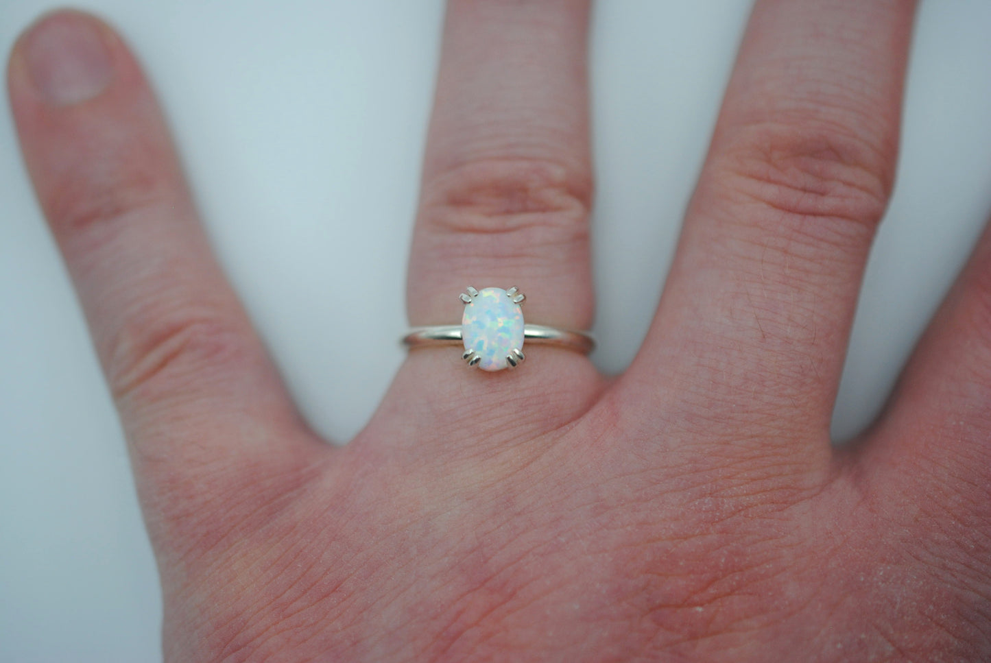 Opal Ring: Oval Cut, Silver, Double Prong Setting