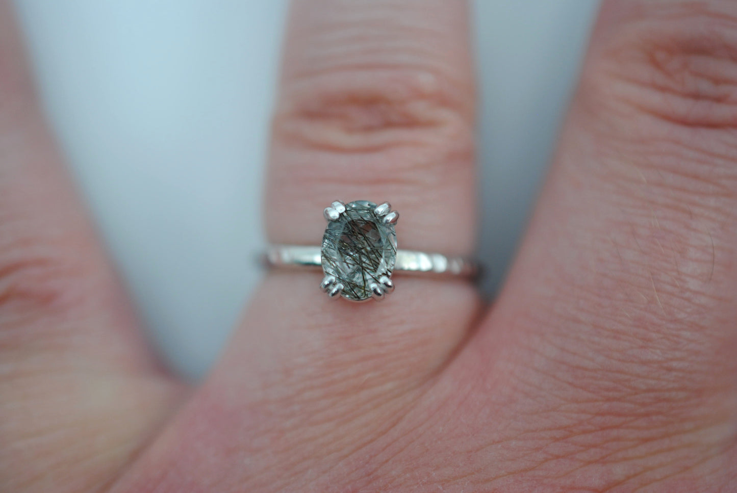 Oval Rutilated Quartz Solitaire Ring on Hammered Band