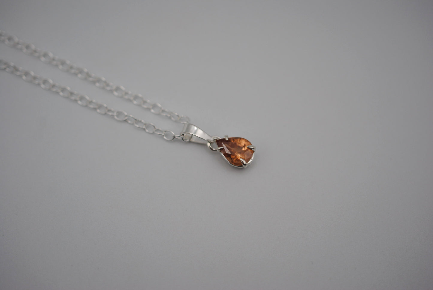 Malaia Garnet Necklace: Pear Cut, Silver Setting, Cable Chain
