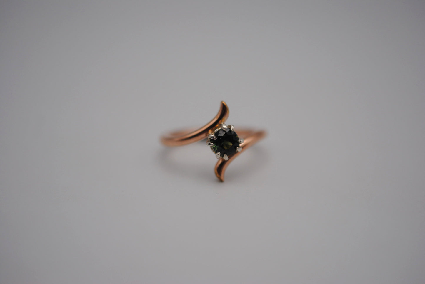 Round Nigerian Sapphire on Rose Gold Bypass Band in Silver Setting Ring