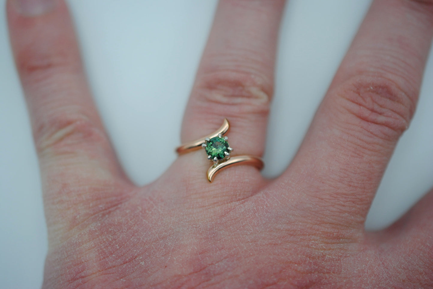 Round Nigerian Sapphire on Rose Gold Bypass Band in Silver Setting Ring