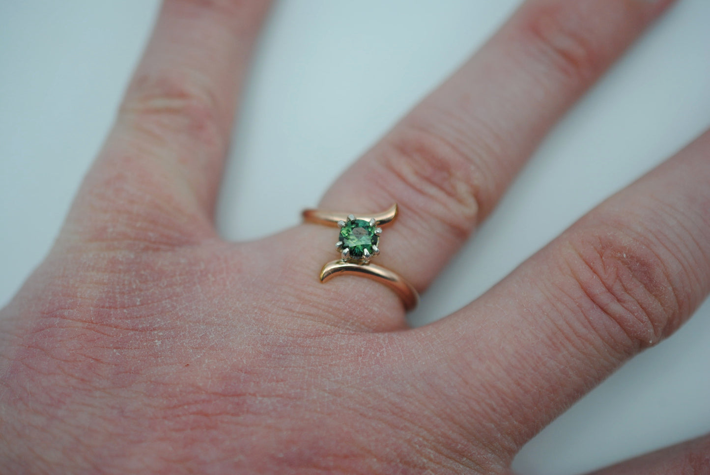 Round Nigerian Sapphire on Rose Gold Bypass Band in Silver Setting Ring