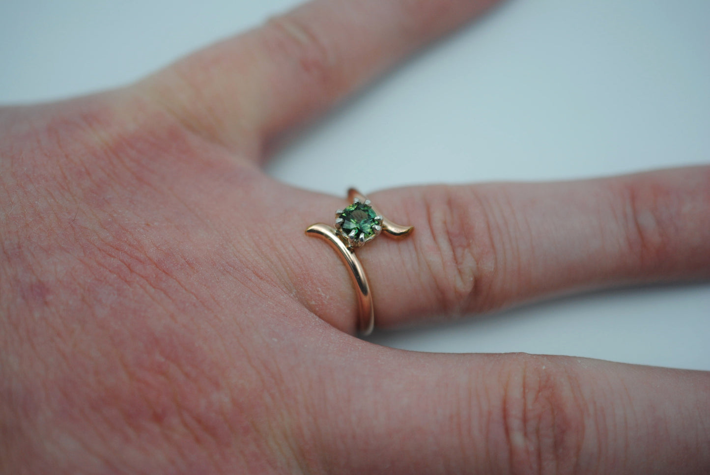 Round Nigerian Sapphire on Rose Gold Bypass Band in Silver Setting Ring
