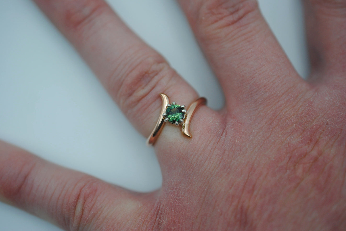 Round Nigerian Sapphire on Rose Gold Bypass Band in Silver Setting Ring