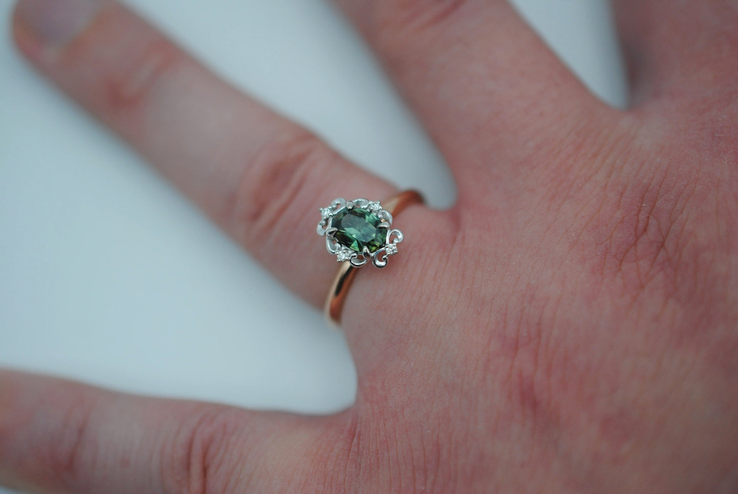 Sapphire Ring: Oval Cut, Rose Gold Band, Melee White Gold Setting