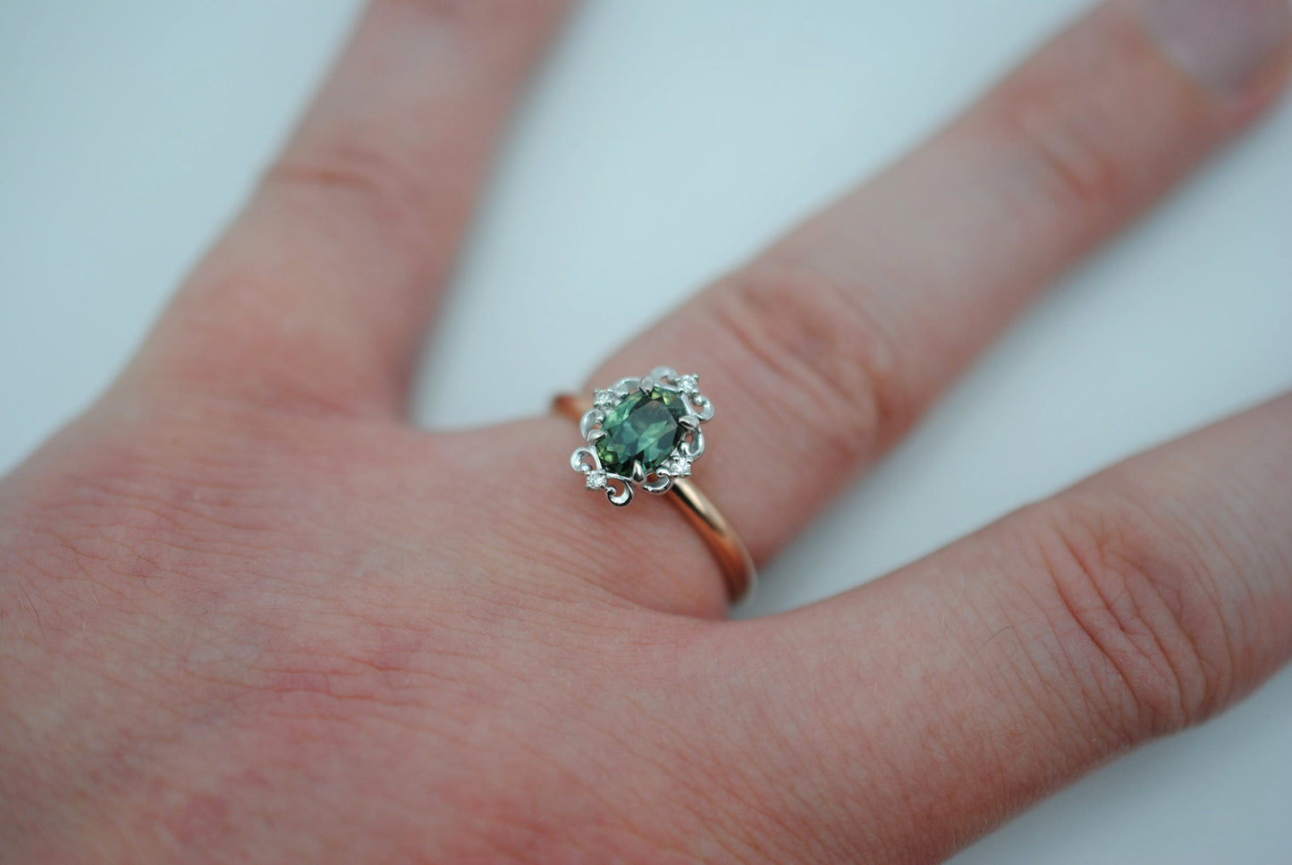 Sapphire Ring: Oval Cut, Rose Gold Band, Melee White Gold Setting