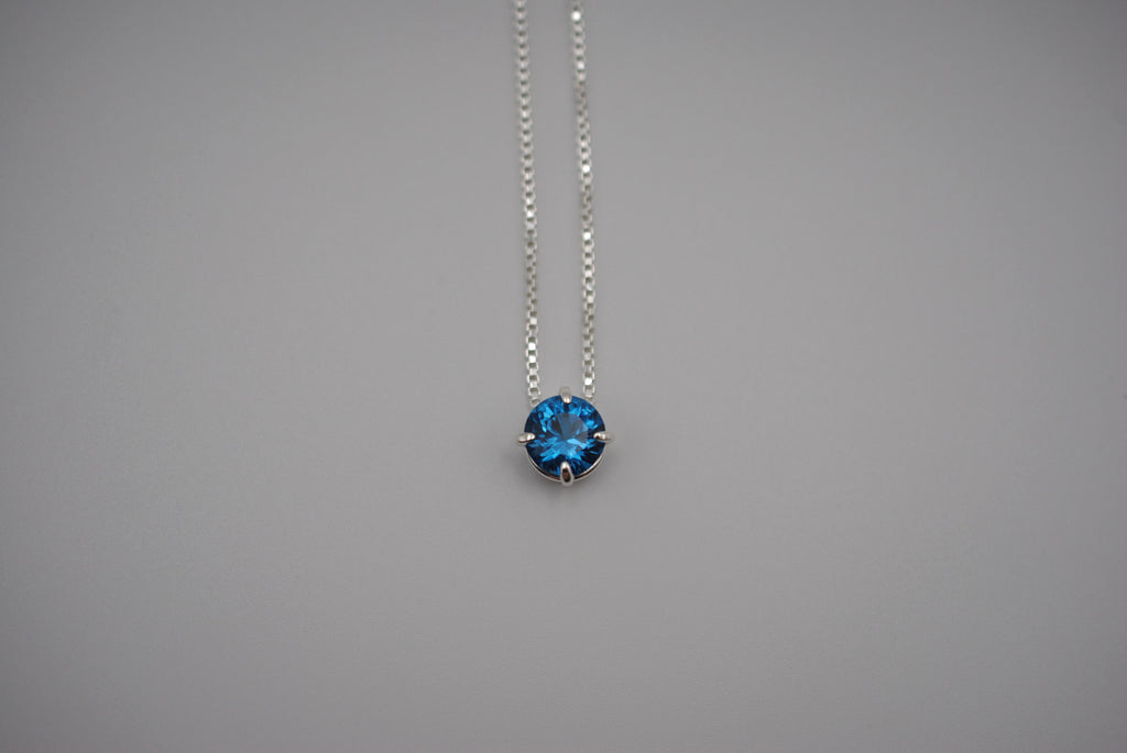 Birthstone Necklace: Round Blue Zircon, Silver Prong Setting, Adjustable Chain