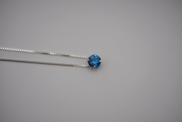 Birthstone Necklace: Round Blue Zircon, Silver Prong Setting, Adjustable Chain