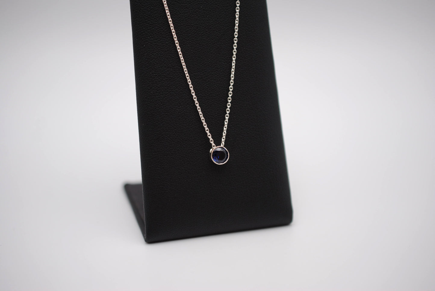 Birthstone Necklace: Round Sapphire, Silver Bezel, on Cable Chain