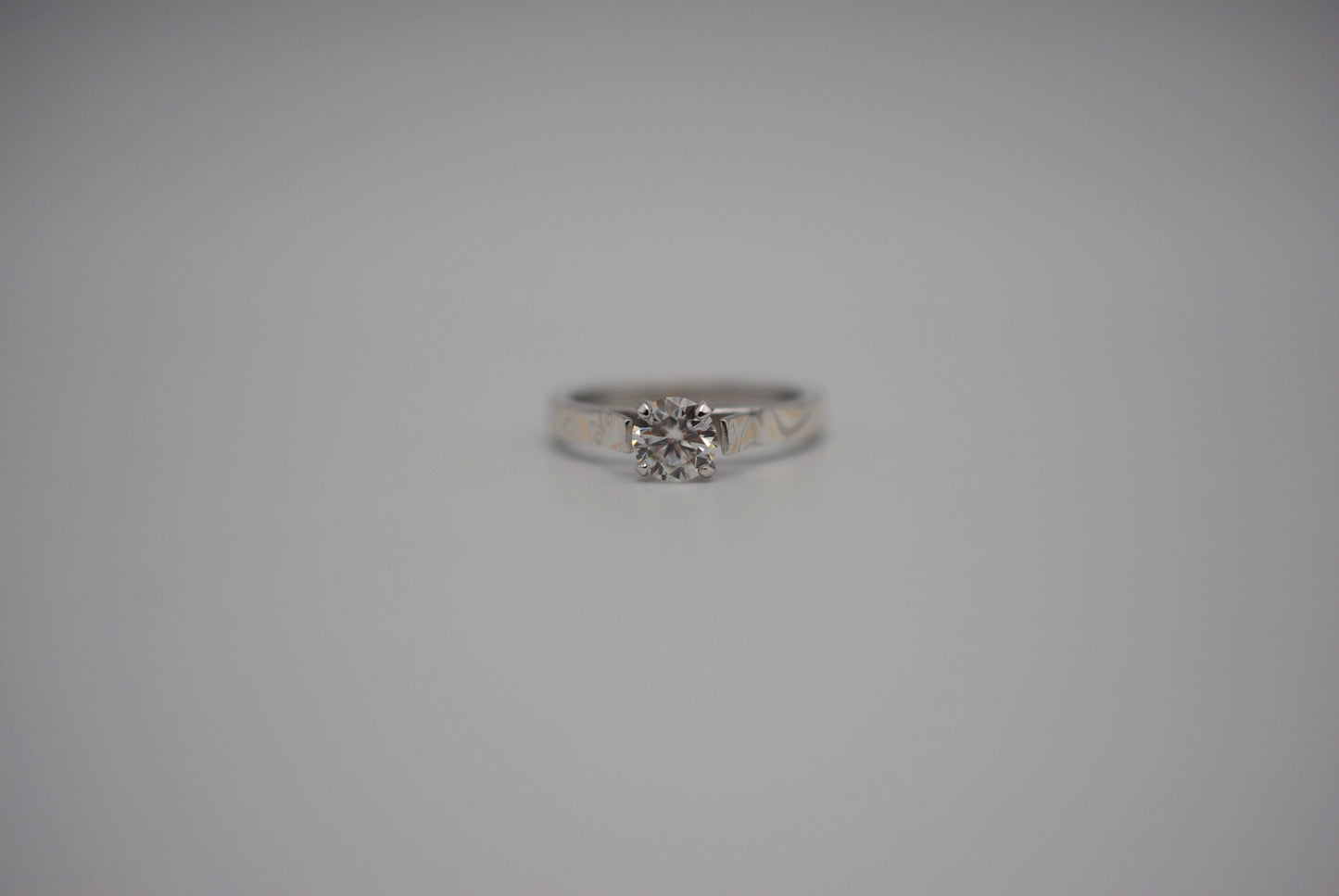 Moissanite Ring: Round Cut, Mokume Game Cathedral Band, White Gold Setting