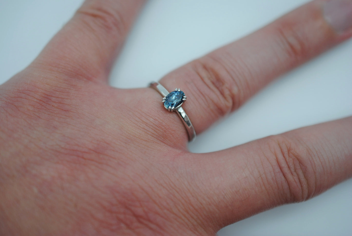 Sapphire Ring: Oval Cut, Hammered Band, Rhodium Finished