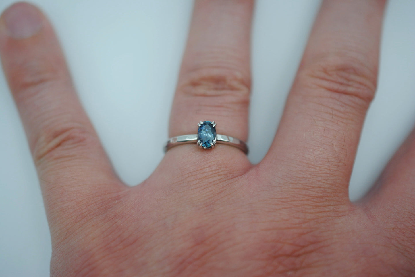 Sapphire Ring: Oval Cut, Hammered Band, Rhodium Finished