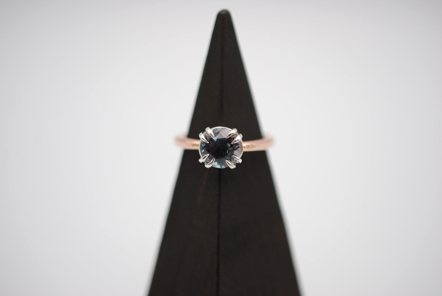 Blue Tourmaline Ring: Round Cut, Rose Gold Band, Silver Setting