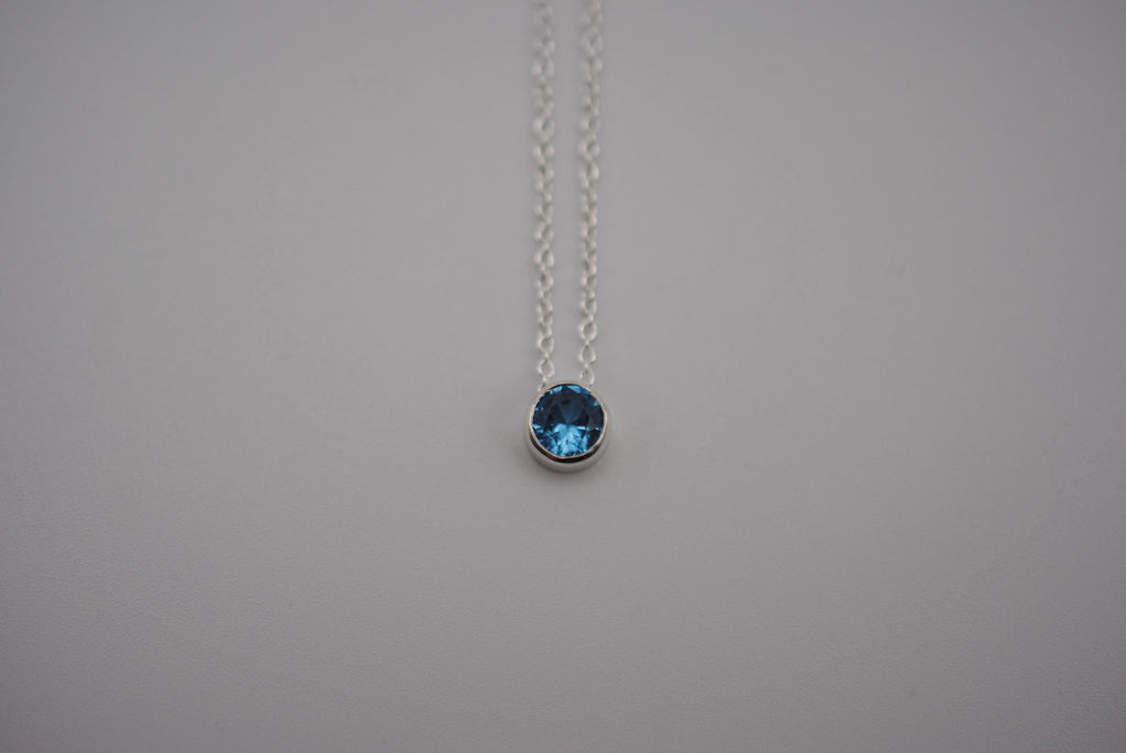 Birthstone Necklace: Round Blue Zircon, Bezel, Silver, Cable Chain