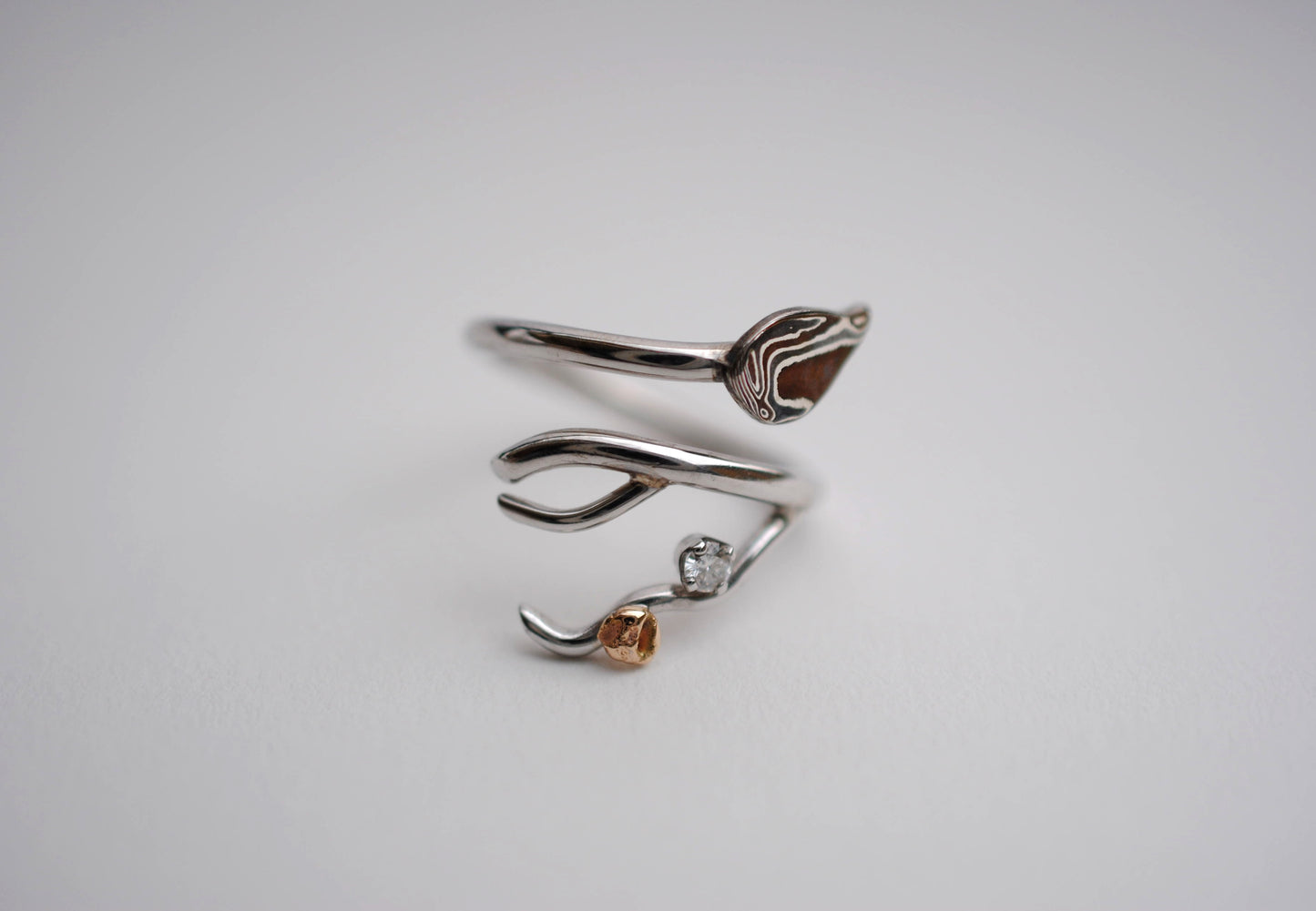 Branching Mokume Leaf Rhodium Wedding Ring with Moissanite and Gold Accent