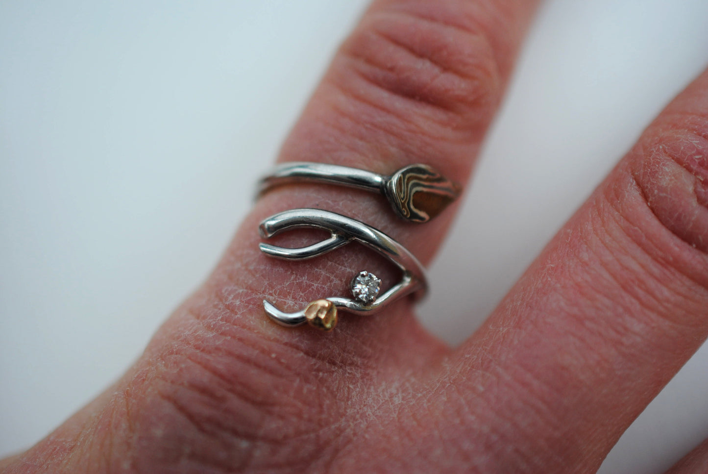 Branching Mokume Leaf Rhodium Wedding Ring with Moissanite and Gold Accent