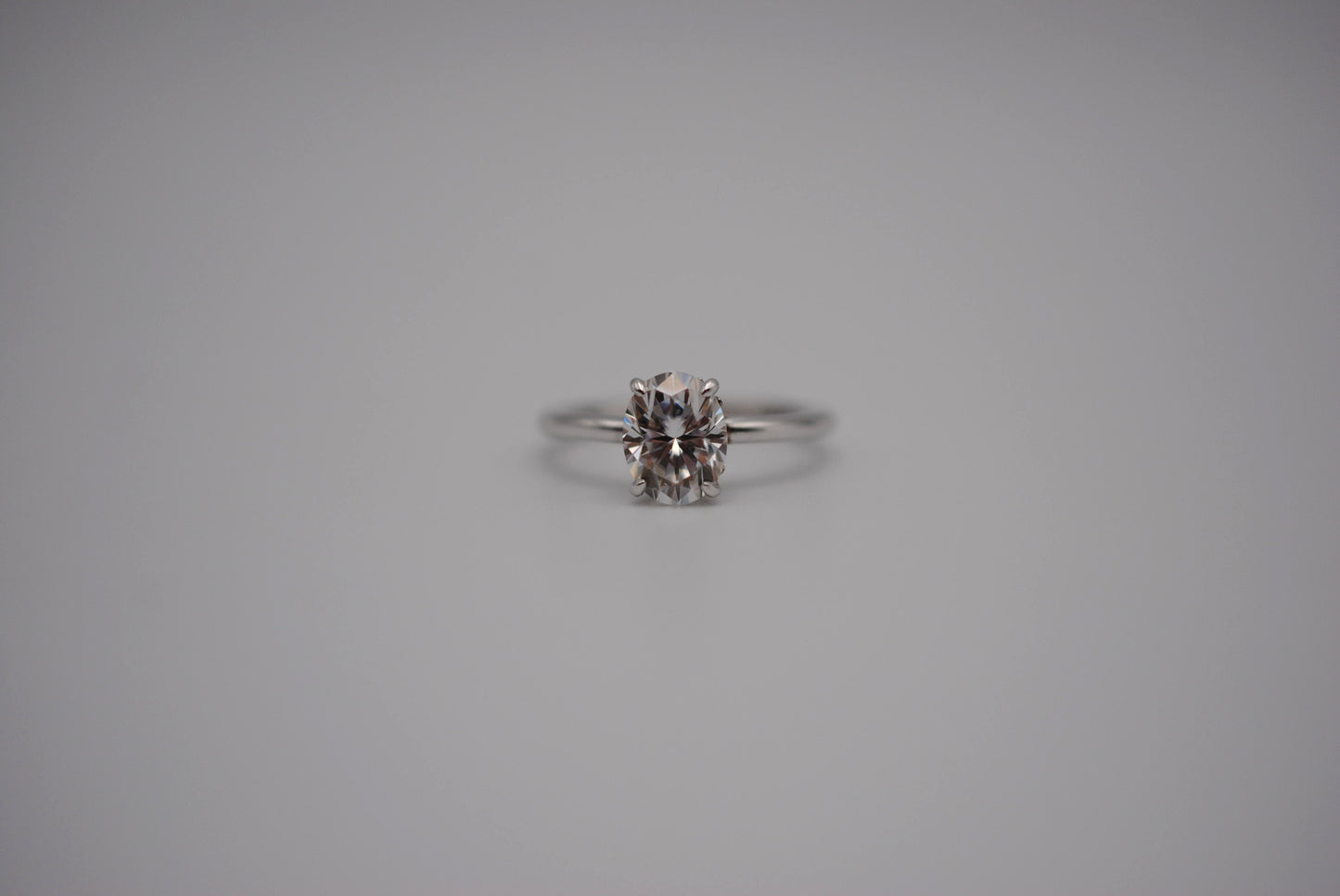 Moissanite Ring: Oval Cut, White Gold, Filligree Prong Setting