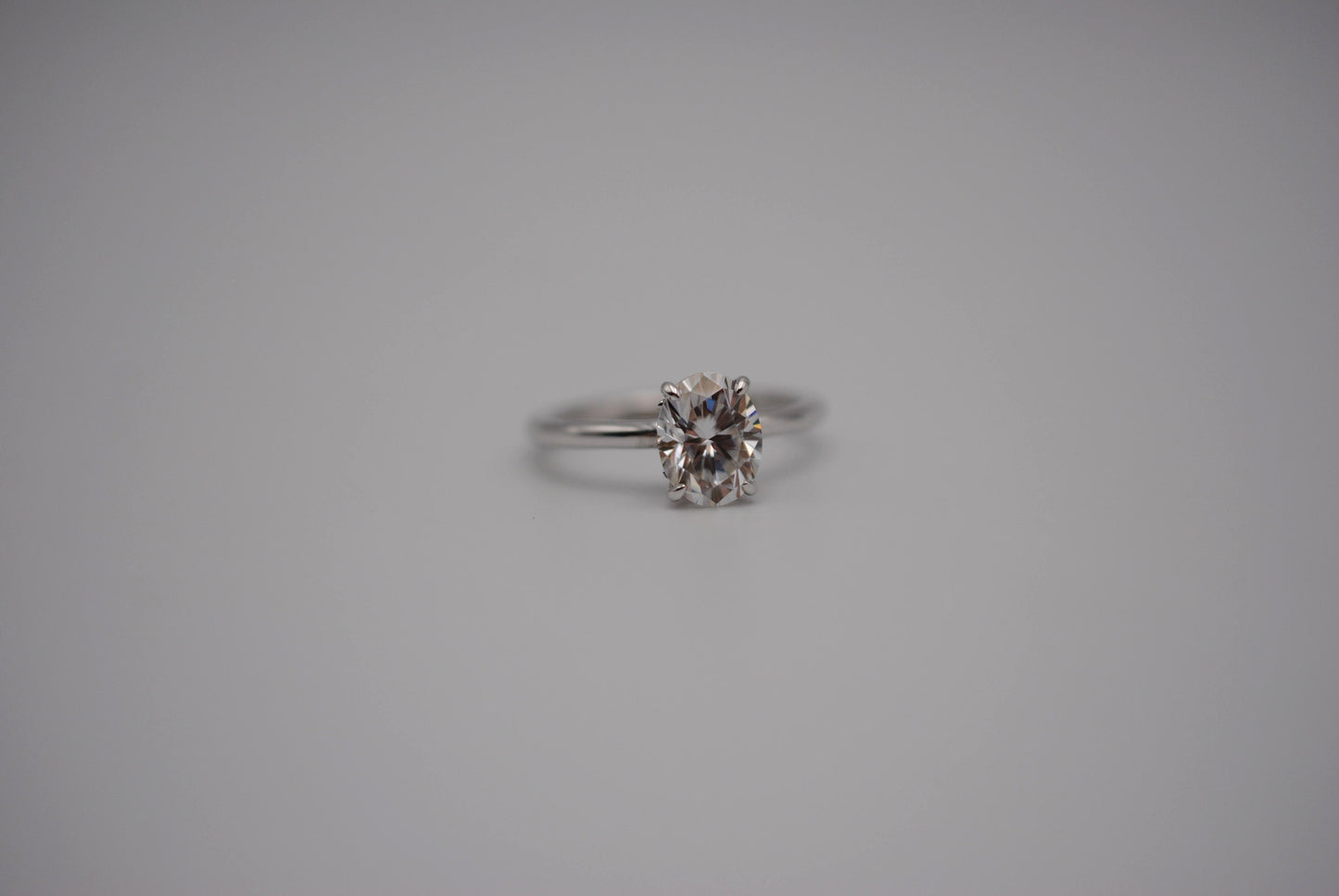 Moissanite Ring: Oval Cut, White Gold, Filligree Prong Setting