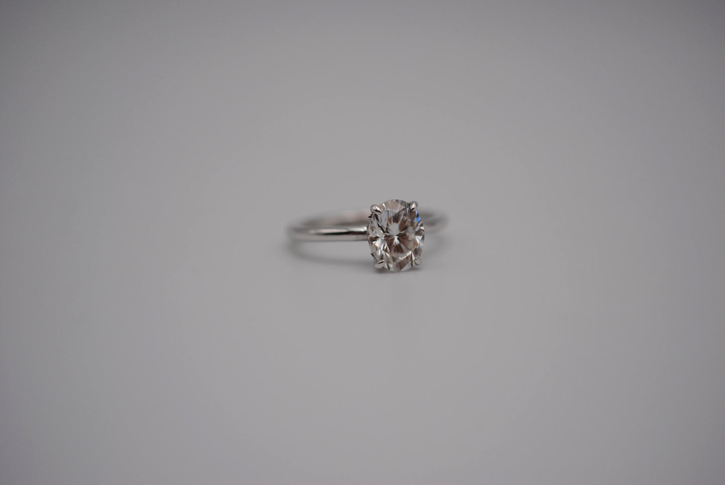 Moissanite Ring: Oval Cut, White Gold, Filligree Prong Setting