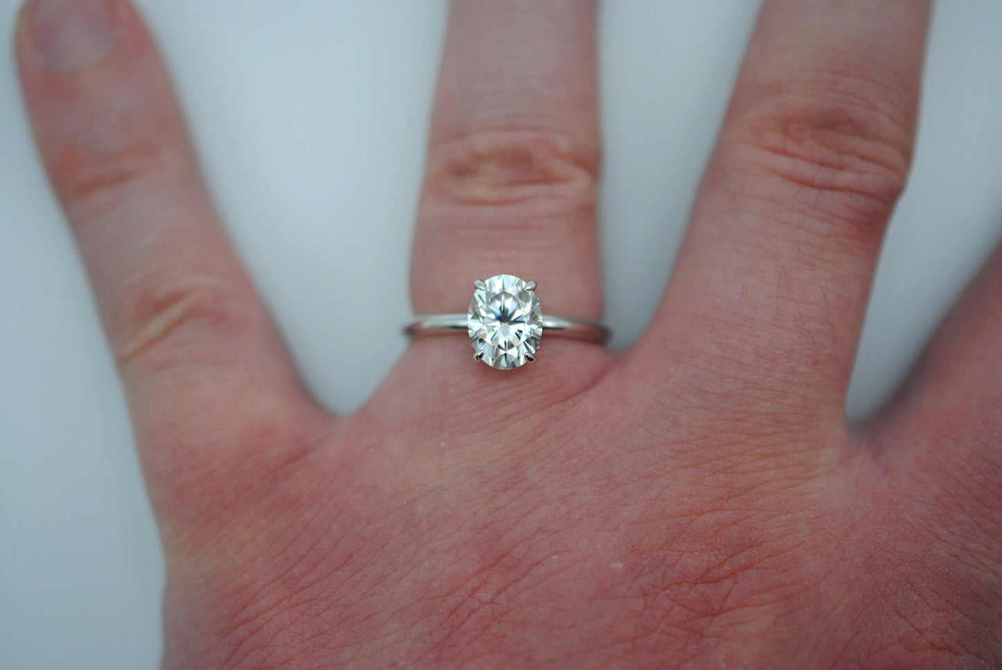 Moissanite Ring: Oval Cut, White Gold, Filligree Prong Setting