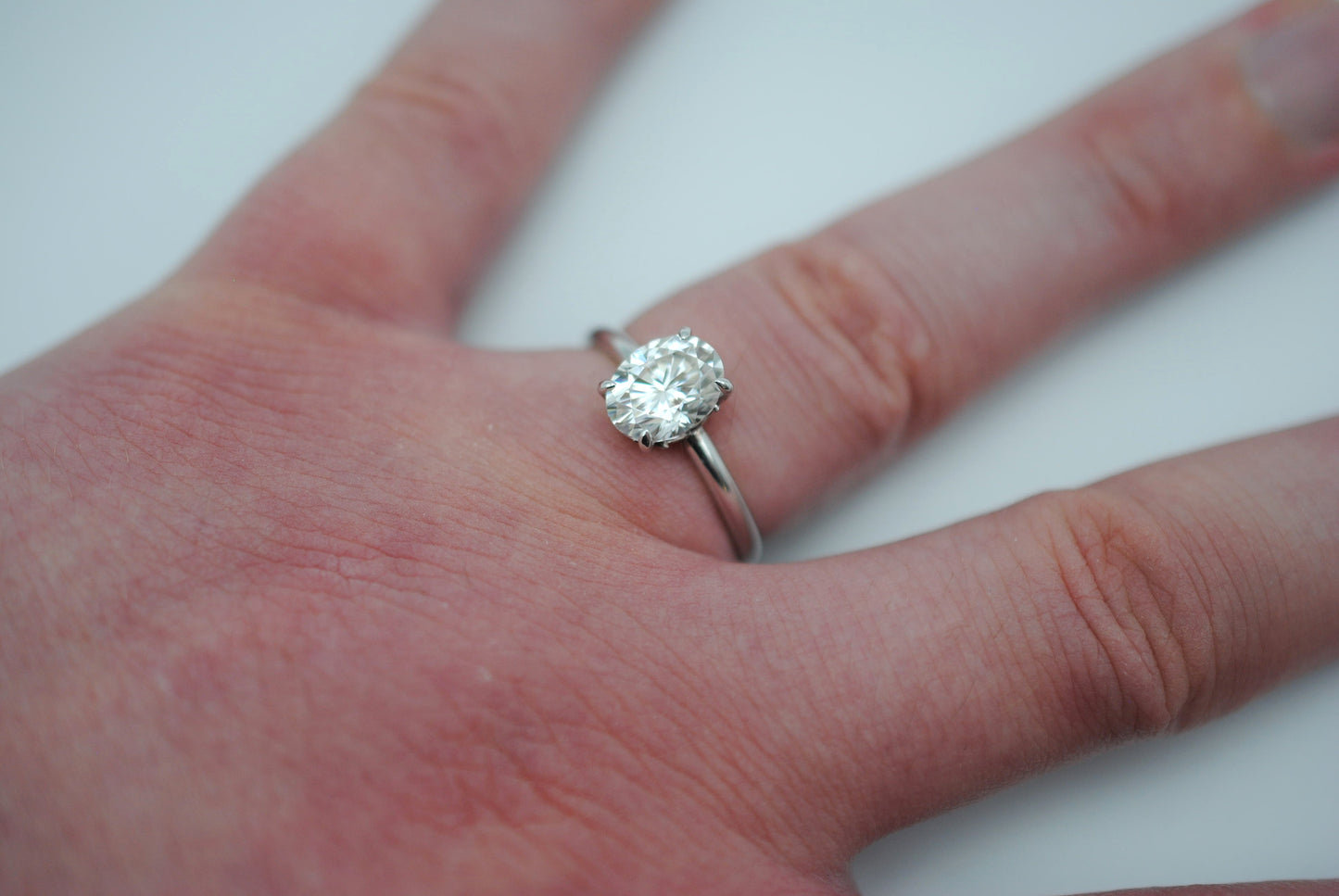 Moissanite Ring: Oval Cut, White Gold, Filligree Prong Setting