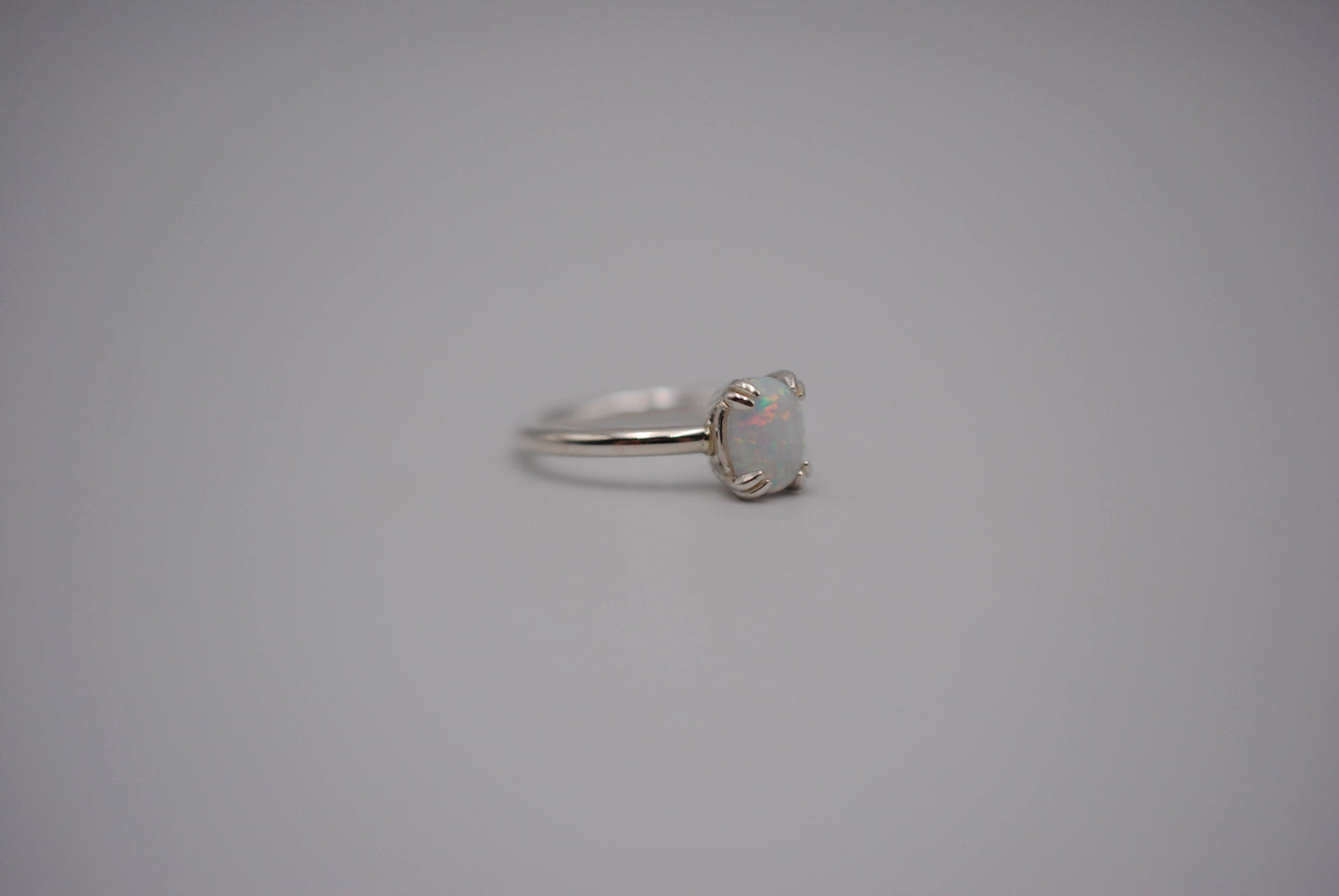 Opal Ring: Oval Cut, Silver, Double Prong Setting